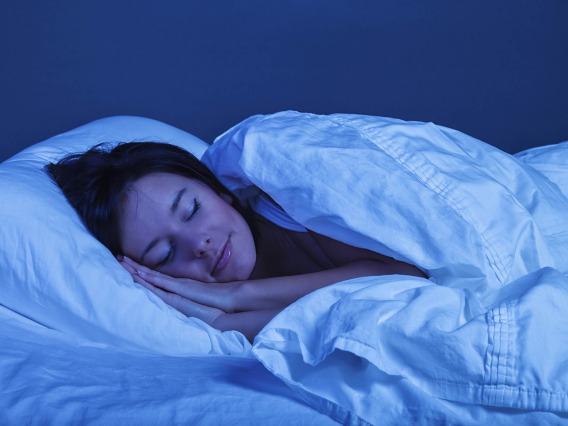 woman peacefully sleeping in bed at night